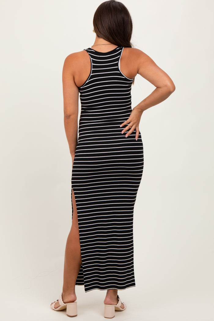 woman wearing a black and white striped maternity maxi dress with a racerback and side slits, showing a baby bump