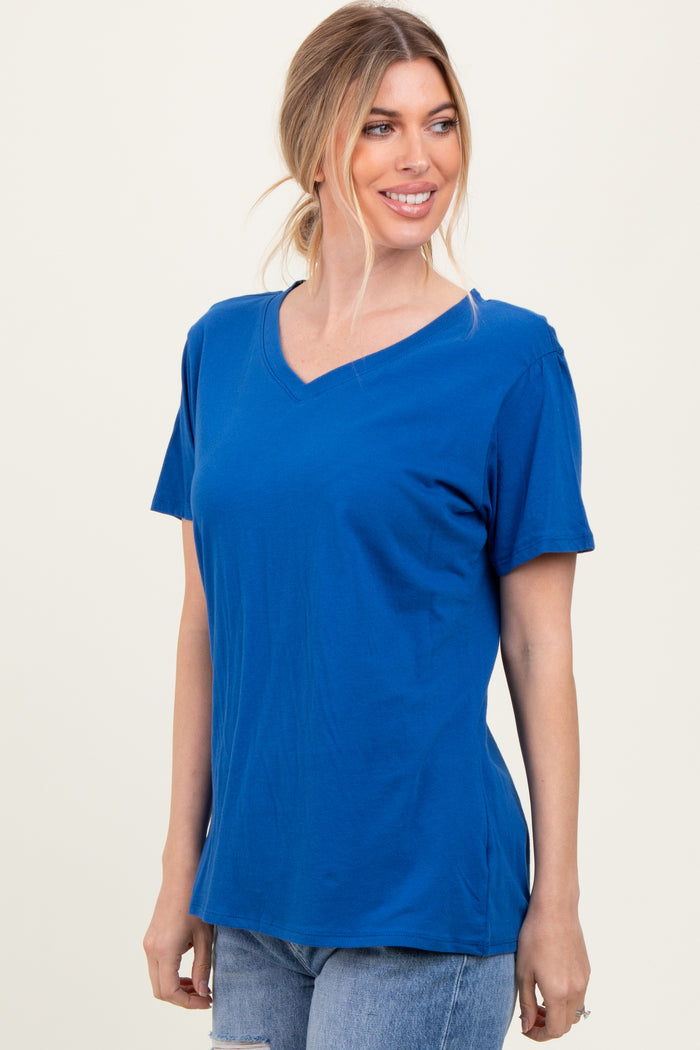 woman wearing a blue v-neck t-shirt with short sleeves and a relaxed fit