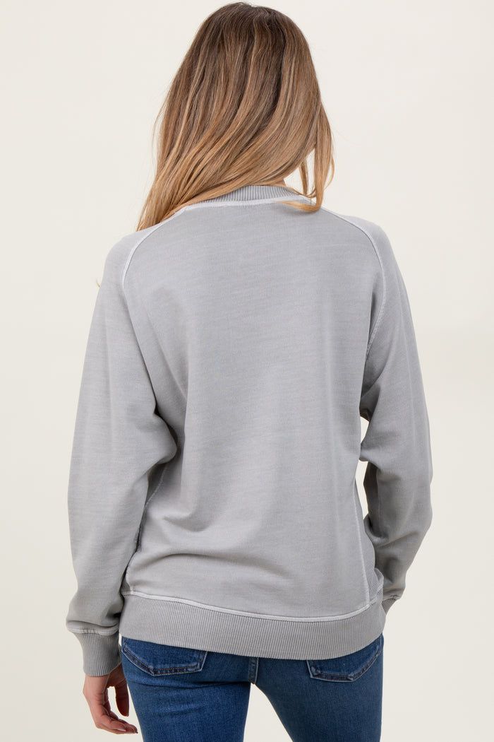 woman wearing a gray maternity sweatshirt with ribbed cuffs and hem, viewed from the back