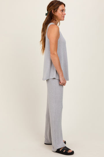woman wearing a light gray ribbed tank top and matching wide-leg pants in a relaxed fit