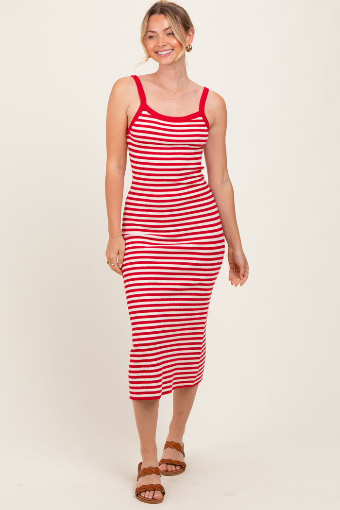 woman wearing a red and white striped midi dress with thin straps and a fitted silhouette