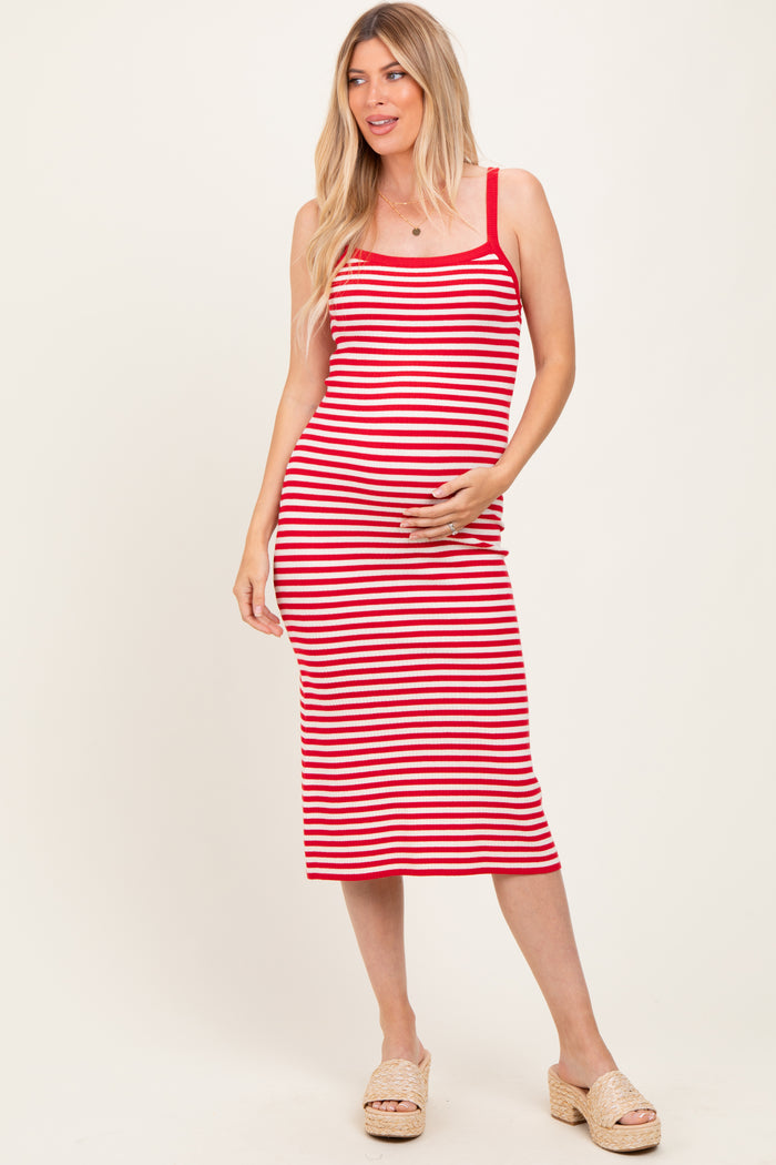 woman wearing a red and white striped maternity dress and holding her baby bump