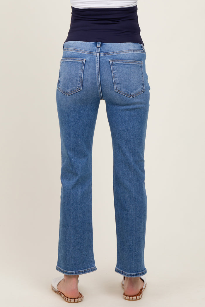 woman wearing maternity light blue straight leg jeans with a flexible waistband, viewed from the back