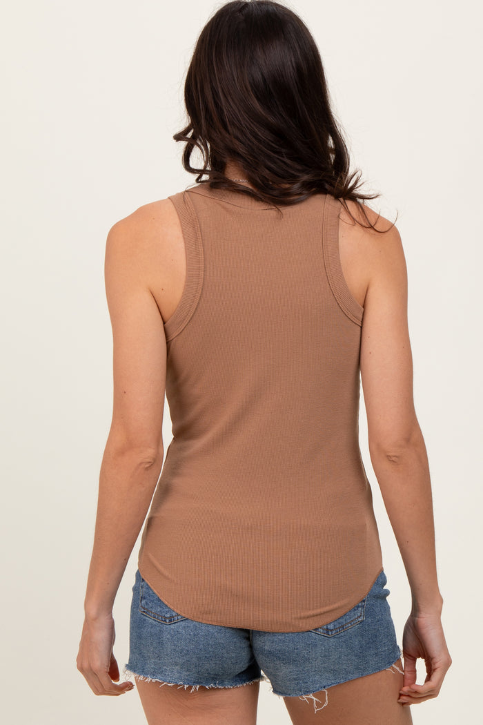 woman wearing a brown ribbed tank top and blue denim shorts, seen from the back