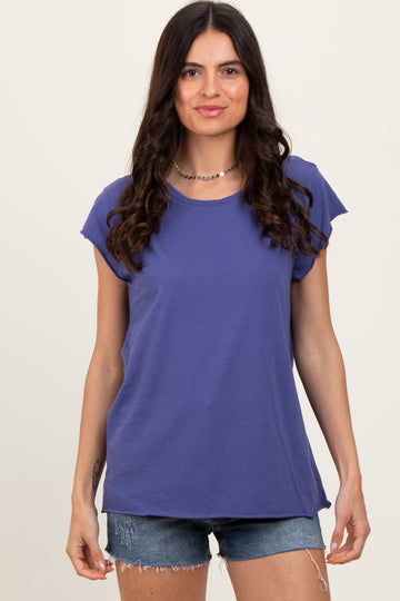 woman wearing a purple short sleeve t-shirt and denim shorts