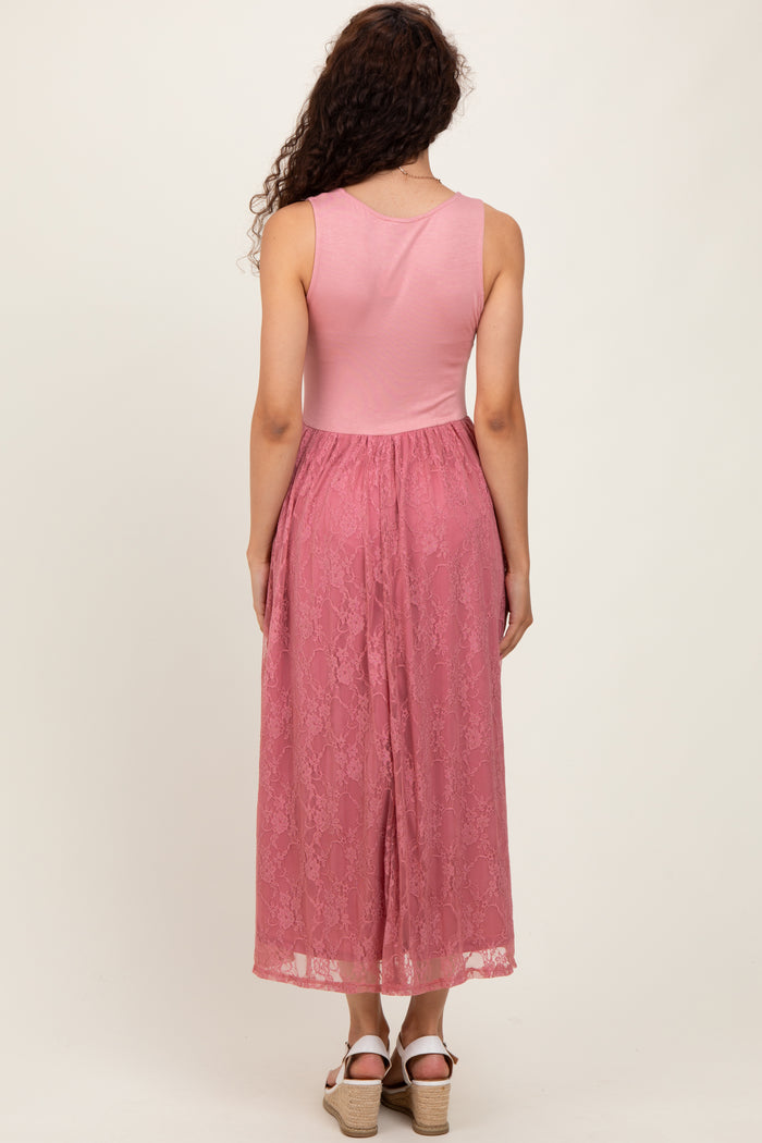 woman wearing a pink maxi dress with a lace skirt and a fitted top, showing the back view