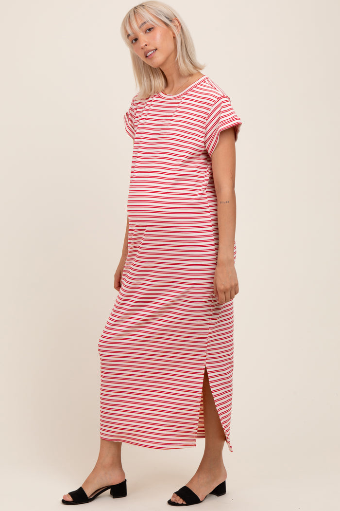 woman wearing a striped maternity maxi dress with short sleeves and a side slit, showcasing her baby bump