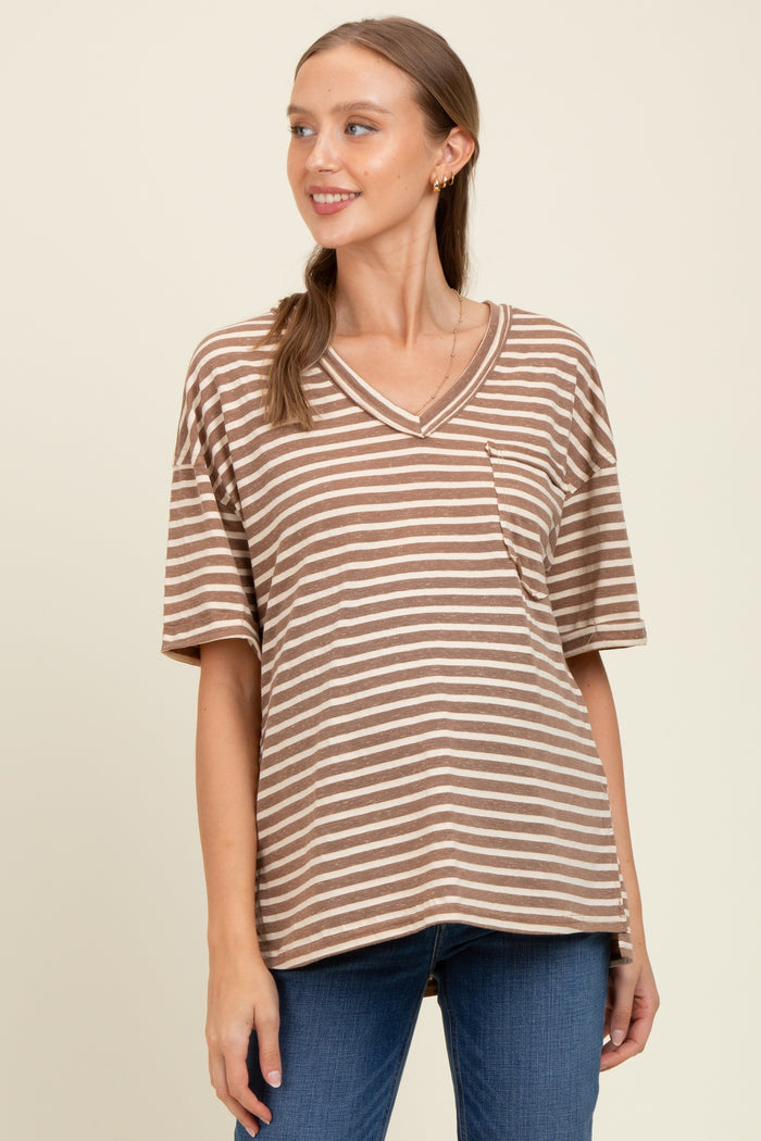 woman wearing a brown and beige striped short sleeve maternity top with a v-neck and pocket