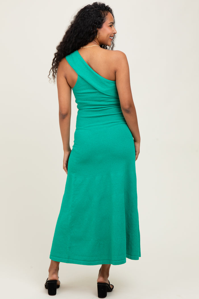 woman wearing a green one-shoulder maternity dress, shown from the back with a fitted silhouette