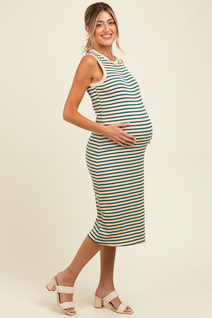 woman wearing a striped maternity dress, showing her baby bump, with a fitted silhouette and sleeveless design