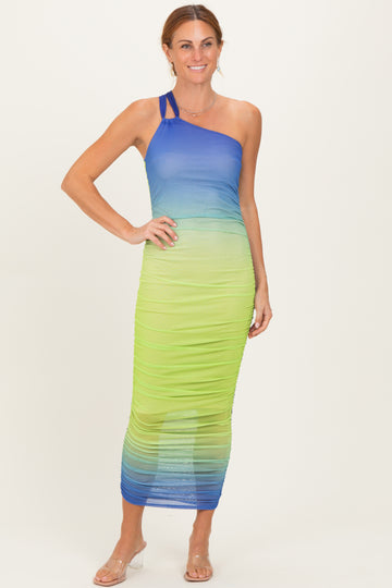 woman wearing a one-shoulder gradient maxi dress in blue and green hues with ruching detail
