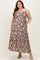 woman wearing a floral brown maternity plus maxi dress with pockets and adjustable straps, showcasing her baby bump