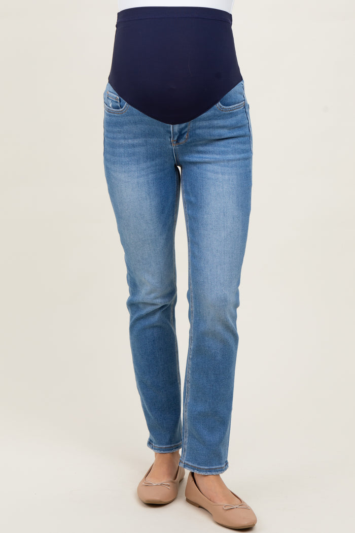 woman wearing light blue maternity jeans with a dark blue over-the-belly panel