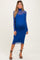 woman wearing a blue maternity bodycon dress with long sheer sleeves and a visible baby bump