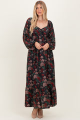 woman wearing a floral long sleeve maxi dress with a sweetheart neckline and ruffle hem