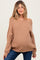 woman wearing a tan off-shoulder maternity sweater with ribbed texture and relaxed fit, showing her baby bump