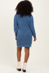 woman wearing a blue ribbed knit sweater dress with long sleeves and a fitted silhouette, facing away from the camera