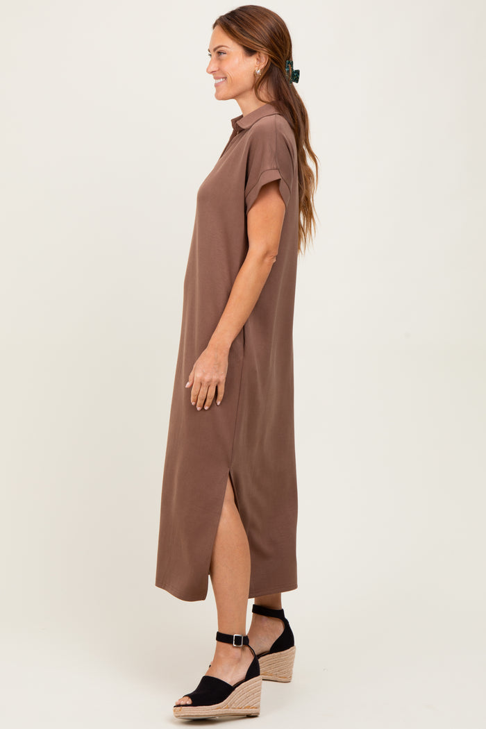 woman wearing a brown short sleeve maxi dress with side slits and wedge sandals