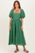 woman wearing a green puff sleeve midi dress with a square neckline and floral embroidery