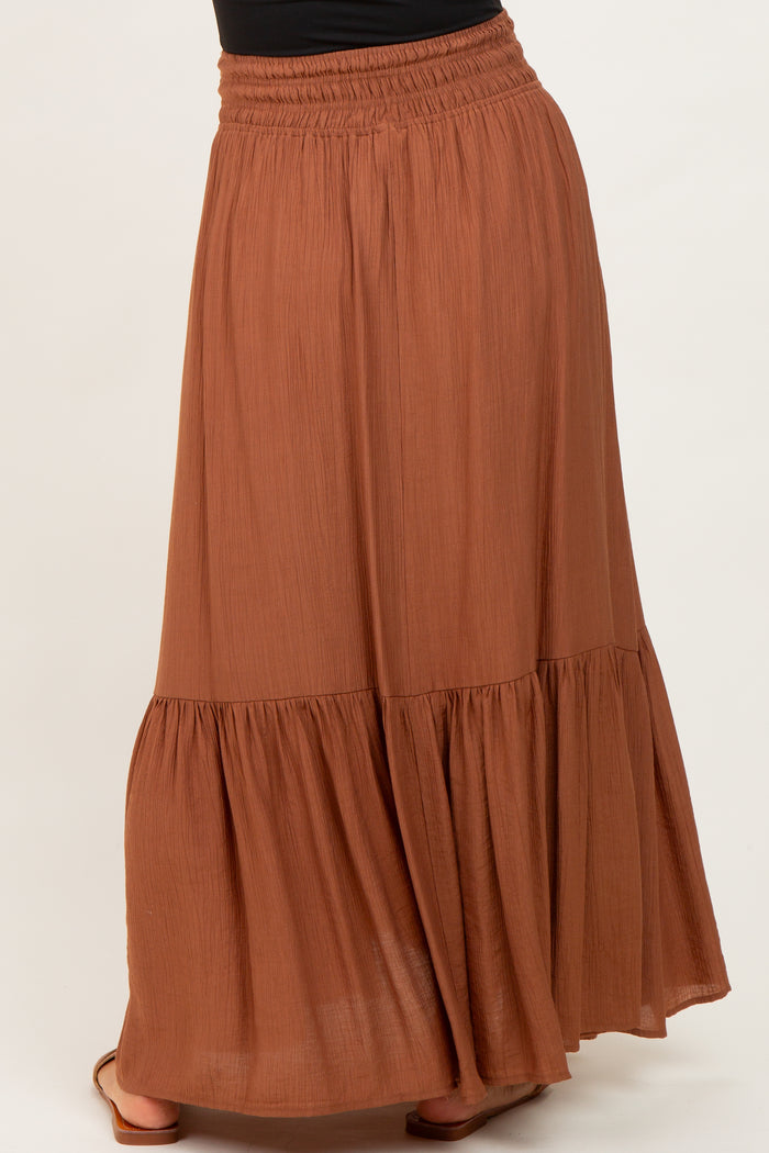 maternity wear rust brown maxi skirt with a tiered design and elastic waistband