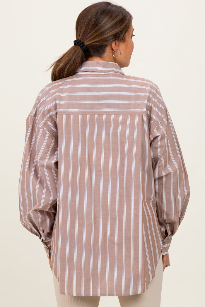 woman wearing a striped maternity shirt with oversized sleeves and a relaxed fit, showing the back view