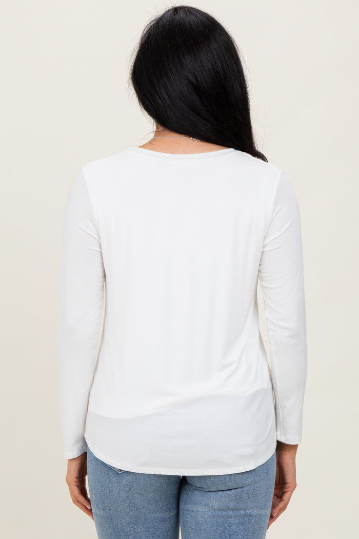 woman wearing a white long sleeve top from the back with a round neckline and casual fit