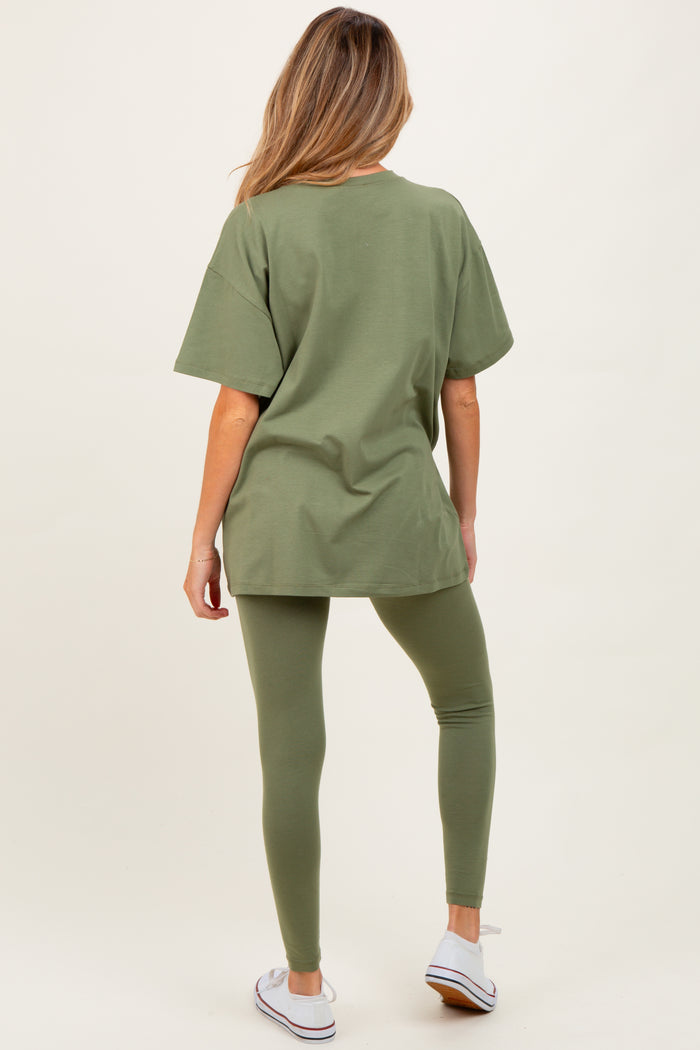 woman wearing an olive green oversized t-shirt and matching leggings, showcasing comfortable maternity wear