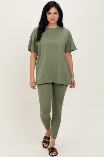 woman wearing an olive green oversized t-shirt and matching leggings with black sandals