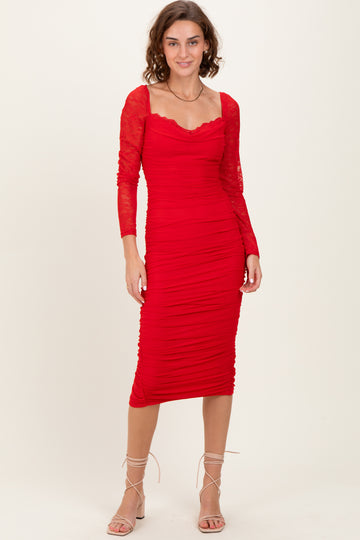 woman wearing a red long sleeve bodycon dress with ruched detailing and lace sleeves