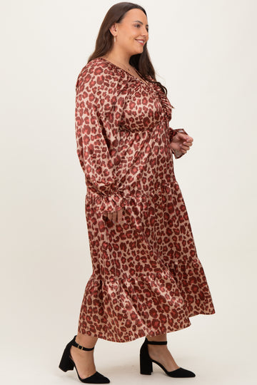 woman wearing a brown leopard print long sleeve plus size dress with ruffle hem and black high heels