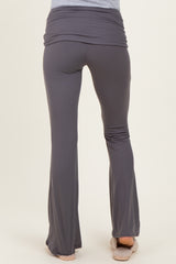 woman wearing gray maternity yoga pants with a fold-over waistband, showing the back view