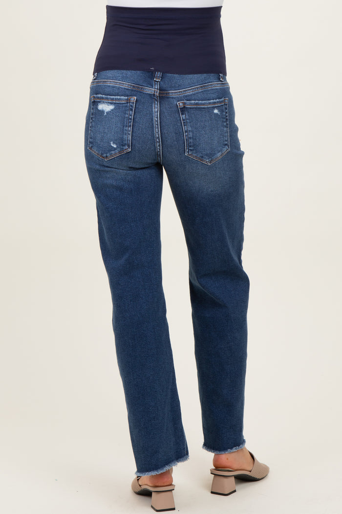 woman wearing dark blue maternity jeans with a distressed hem and a stretchy waistband