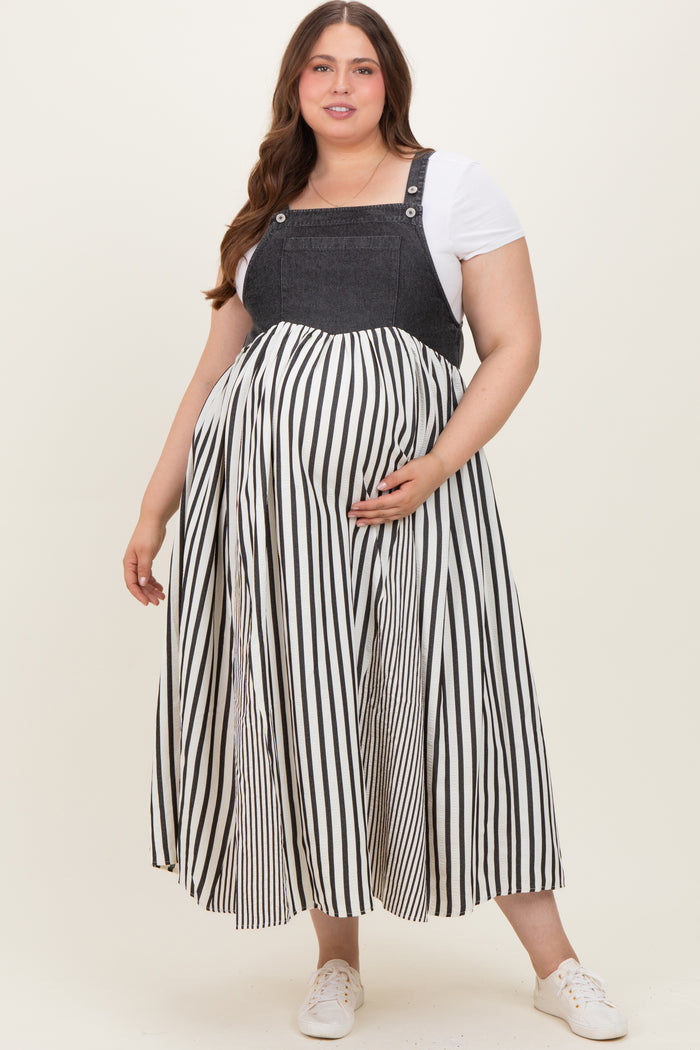 woman wearing a black and white striped maternity dress with denim top, showing her baby bump