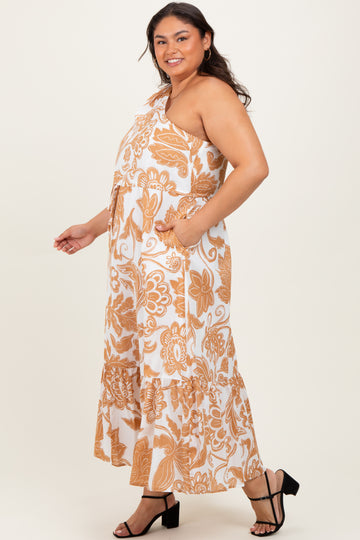 woman wearing a white and orange floral plus size maxi dress with a one-shoulder design and pockets
