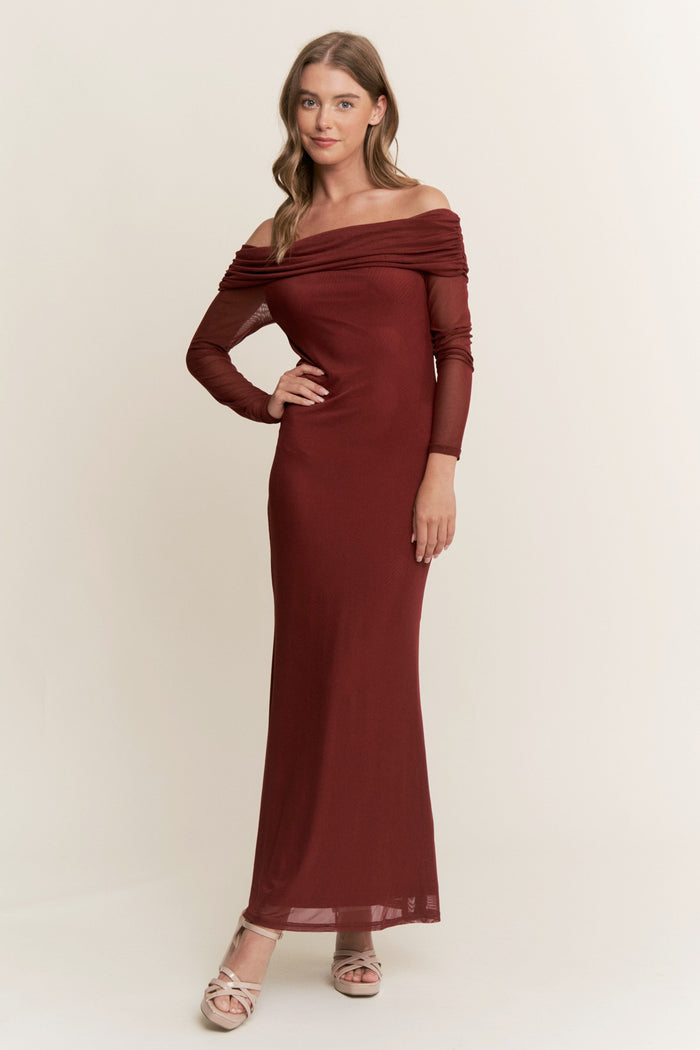 woman wearing a deep red off-the-shoulder long sleeve maxi dress with ruched detailing