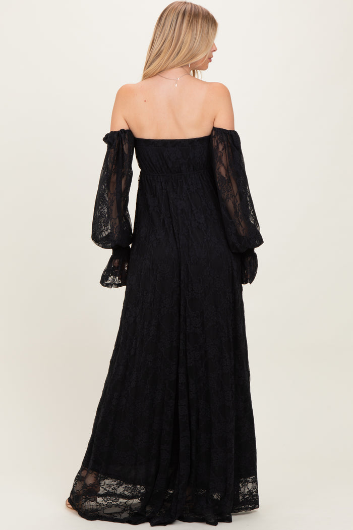 woman wearing a black off-shoulder lace maxi dress with long, puffed sleeves, shown from the back