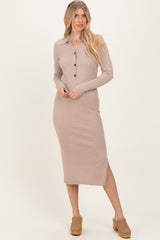 woman wearing a beige ribbed button-up midi dress with long sleeves and a side slit