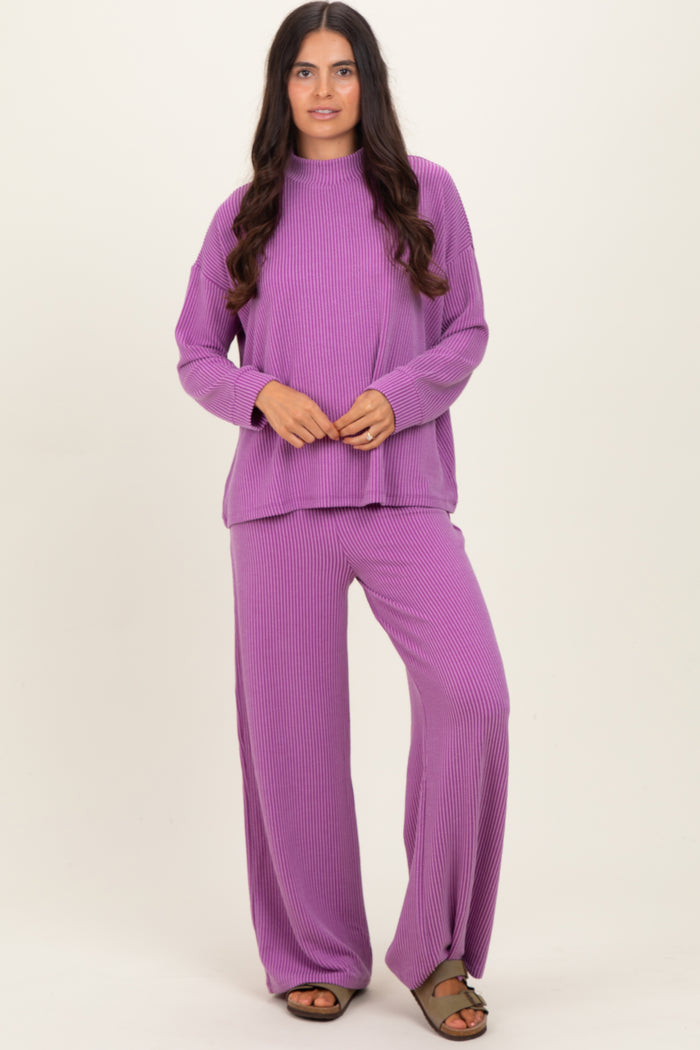 woman wearing a purple ribbed knit long sleeve top and matching wide-leg pants