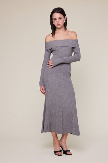 woman wearing a grey ribbed off-the-shoulder long sleeve maxi dress on a neutral background