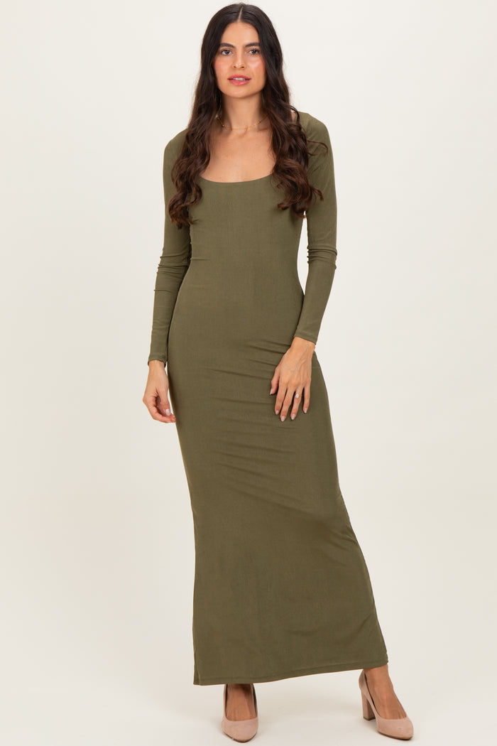 woman wearing a long sleeve olive green maxi dress with a square neckline and fitted silhouette