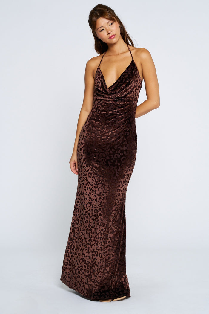 woman wearing a brown leopard print maxi dress with a v-neckline and spaghetti straps