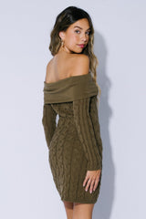 woman wearing an olive green off-shoulder cable knit sweater dress with long sleeves