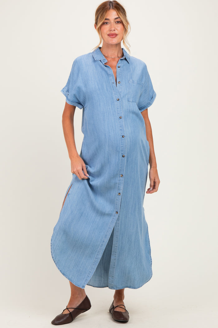 woman wearing a light blue denim maxi dress and showing her baby bump