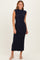 woman wearing a navy blue ribbed sleeveless midi dress with a high neckline and fitted silhouette