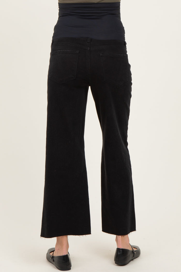 woman wearing black maternity wide-leg pants with a high waistband, viewed from the back