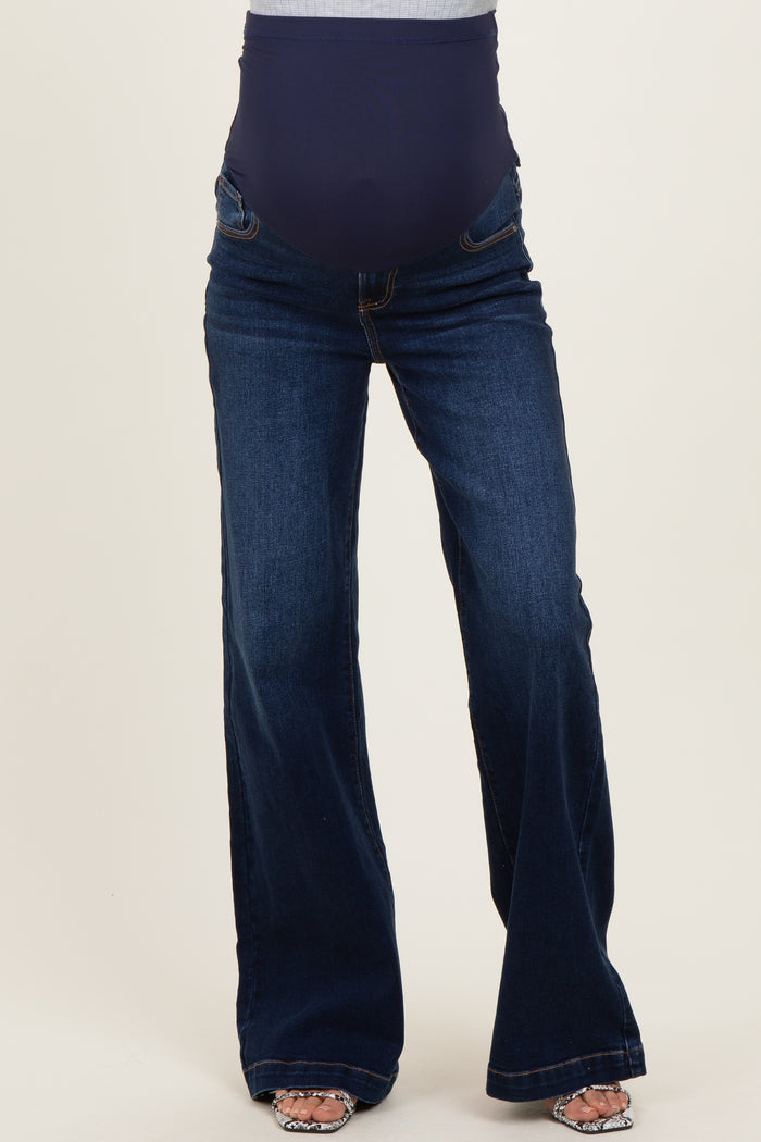 woman wearing dark blue maternity flare jeans with a high stretch panel for comfort and support