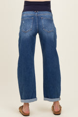 maternity wear: woman wearing blue cuffed maternity jeans with a stretchy waistband seen from the back
