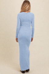 maternity wear light blue ribbed maxi dress with long sleeves and a fitted silhouette, back view