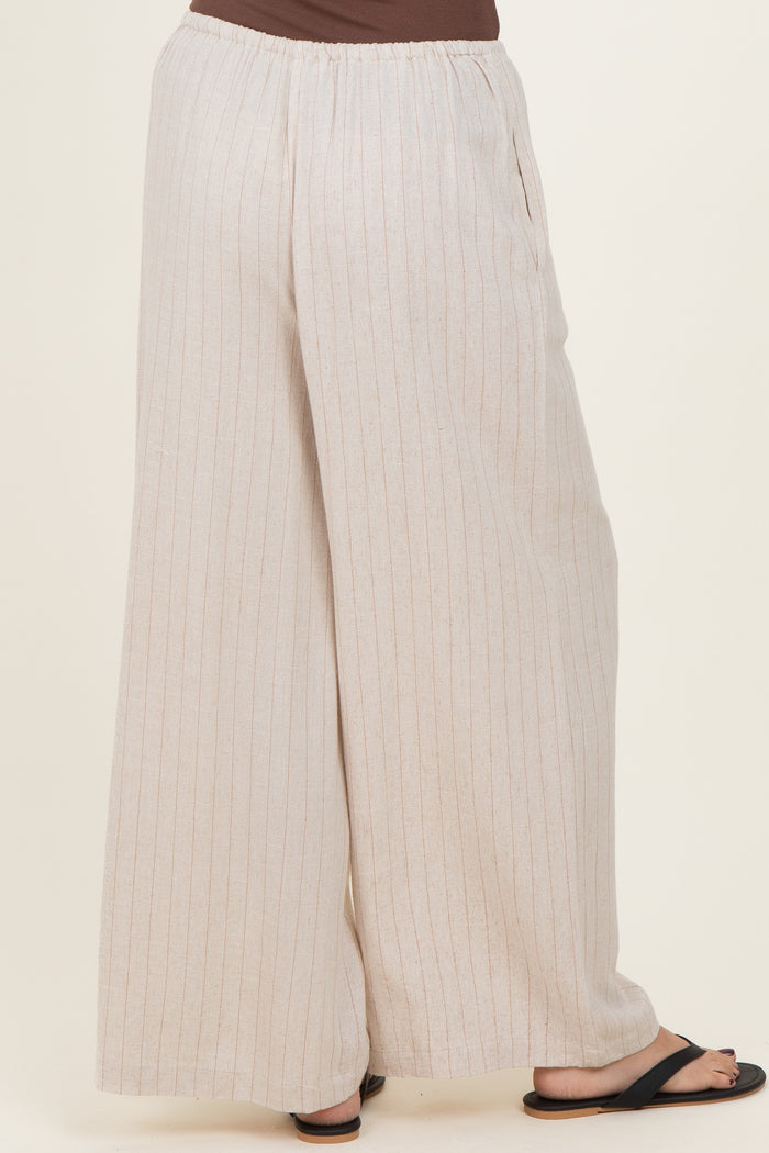 woman wearing light beige striped wide-leg pants with an elastic waistband and side pockets