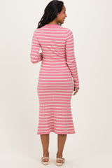 woman wearing a pink striped long sleeve maternity dress, showing a fitted silhouette and midi-length skirt from the back